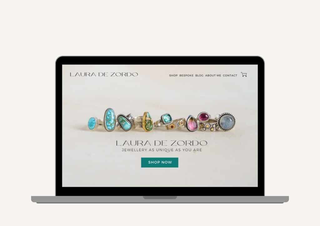 Website homepage design for Laura De Zordo with photo of colourful gemstone rings